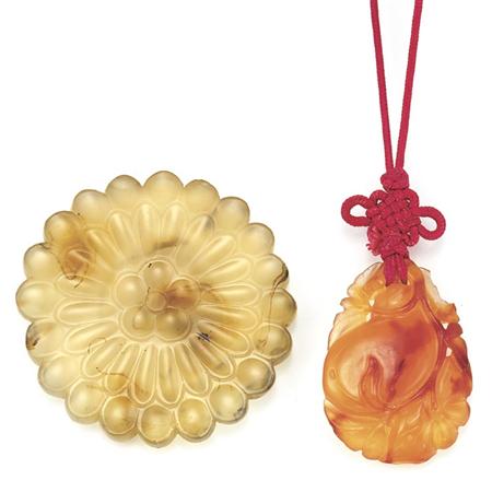 Appraisal: Two Carved Agate Pendants Estimate -