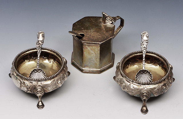 Appraisal: Pair of Victorian silver saltsof circular form with embossed decoration