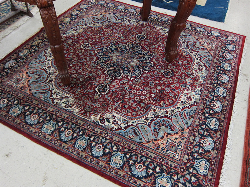 Appraisal: SQUARE ORIENTAL AREA RUG Indo-Persian floral and central floral medallion