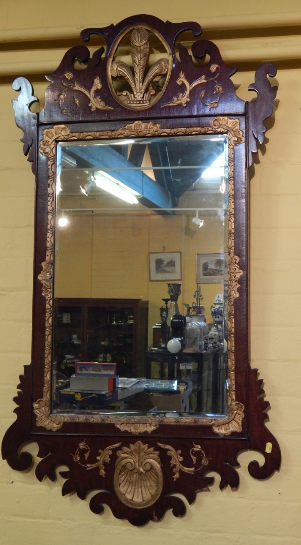 Appraisal: A mahogany and parcel gilt wall mirror in mid thC