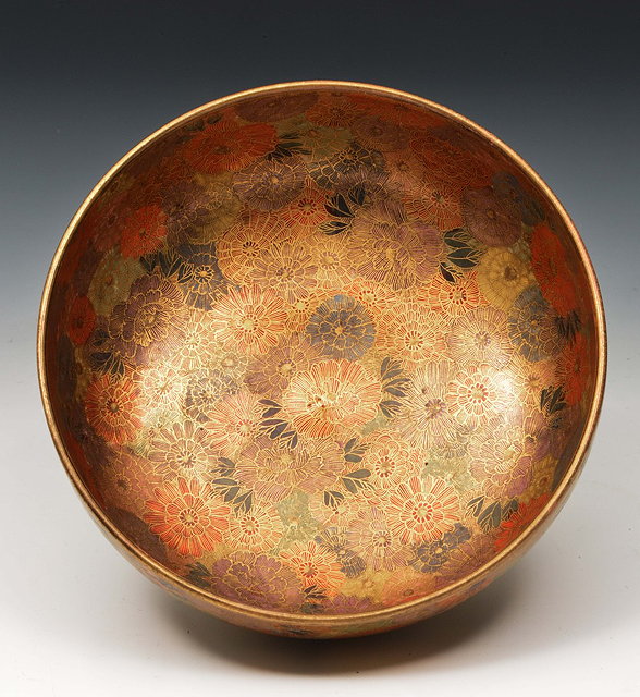 Appraisal: A Japanese Satsuma bowlMeiji periodsigned Gyokuzan decorated with overlapping chrysanthemums