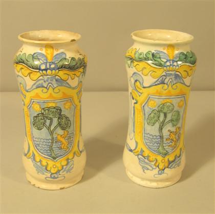 Appraisal: Pair of Italian polychrome maiolica albarelli th century Each painted