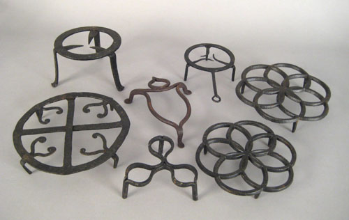 Appraisal: Seven Pennsylvania wrought iron and cast iron trivets early th