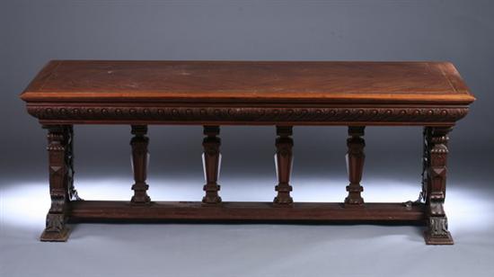 Appraisal: RENAISSANCE REVIVAL CARVED AND INLAID MAHOGANY TRESTLE-BASE LIBRARY TABLE late