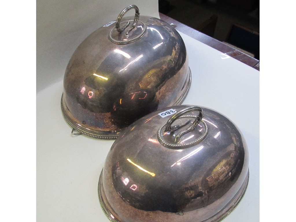 Appraisal: Set of graduated silver plated meat dish covers with handles