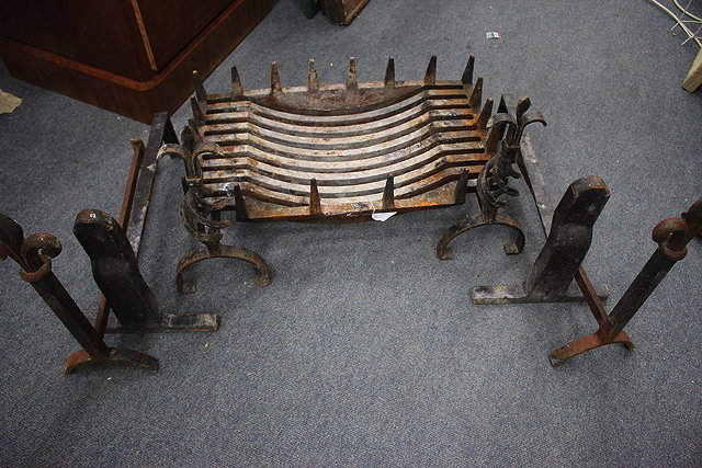 Appraisal: A CAST IRON FIRE GRATE together with three pairs of