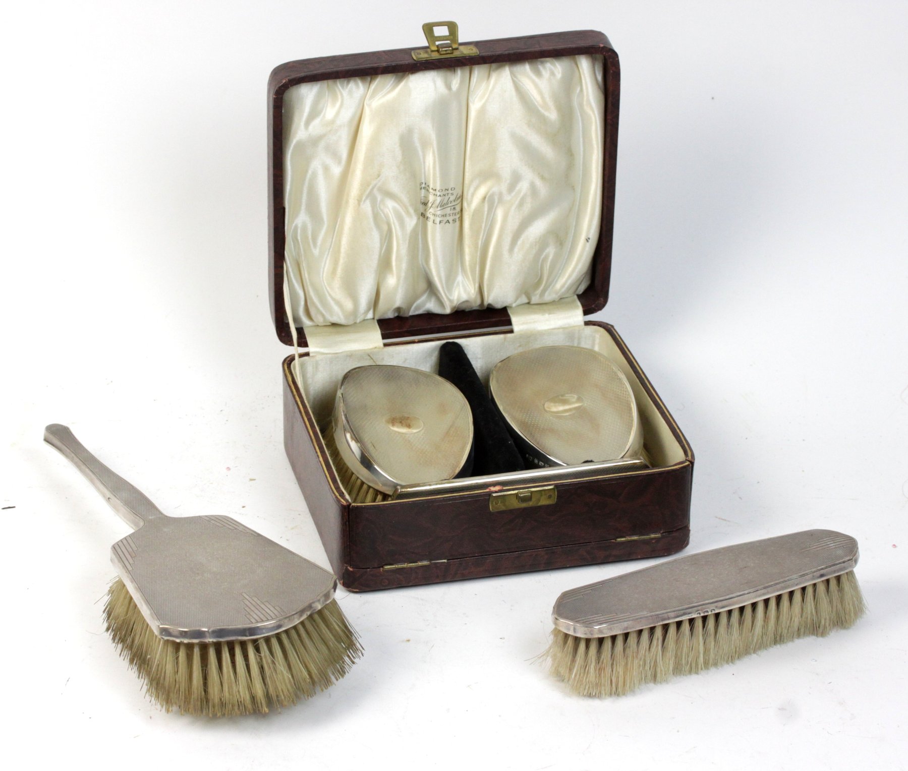 Appraisal: A pair of silver-backed hair brushes and a comb Birmingham