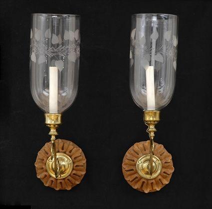 Appraisal: PAIR OF GEORGE III-STYLE BRASS AND CARVED WOOD SINGLE-LIGHT WALL