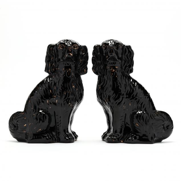 Appraisal: PAIR OF ENGLISH JACKFIELD SPANIELS Circa s black-glazed Staffordshire spaniel