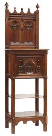 Appraisal: French Gothic Revival walnut cabinet th c richly carved throughout