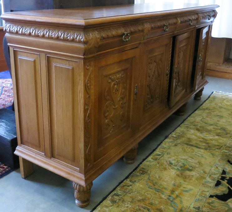 Appraisal: LONG CARVED OAK SIDEBOARD Continental mid- th century having four