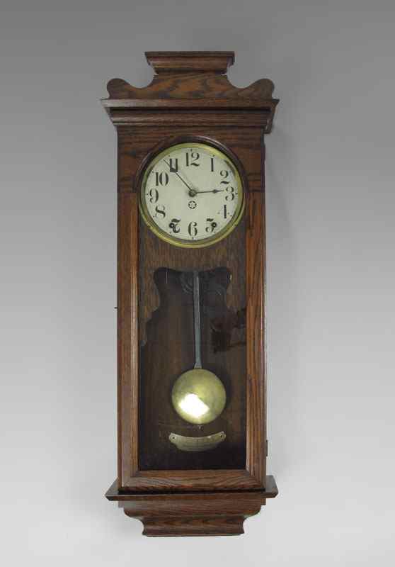 Appraisal: NEW HAVEN OAK CASED WALL CLOCK Oak case paper over