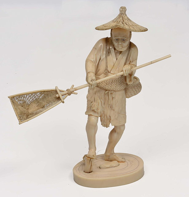 Appraisal: A JAPANESE IVORY OKIMONO in the form of an elderly