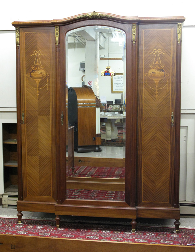 Appraisal: LOUIS XVI STYLE THREE-DOOR ARMOIRE of mahogany with ormolu mounts