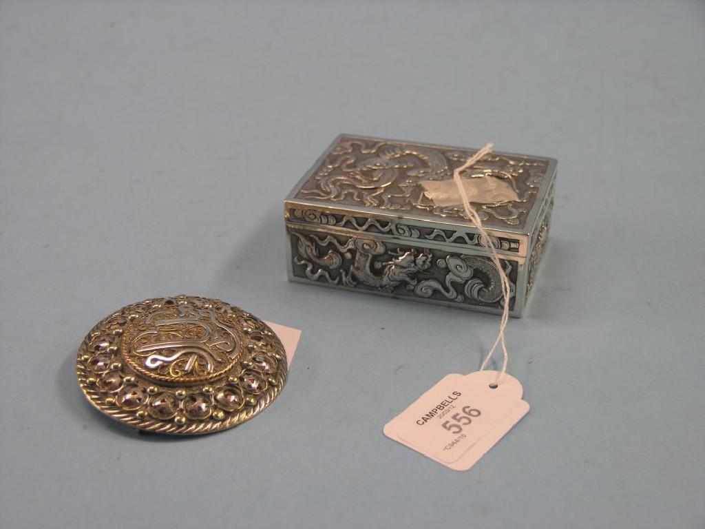 Appraisal: A Chinese silver box rectangular-shape embossed with dragons in and