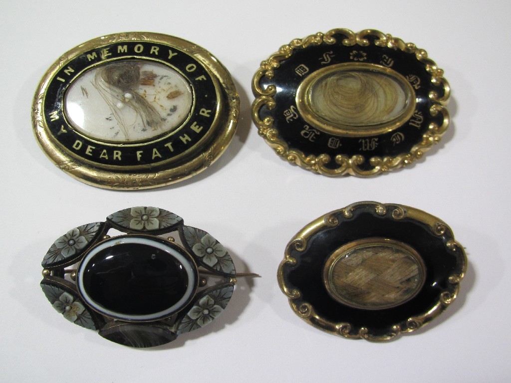 Appraisal: Lot comprising eight Victorian remembrance brooches and a Scottish pebble