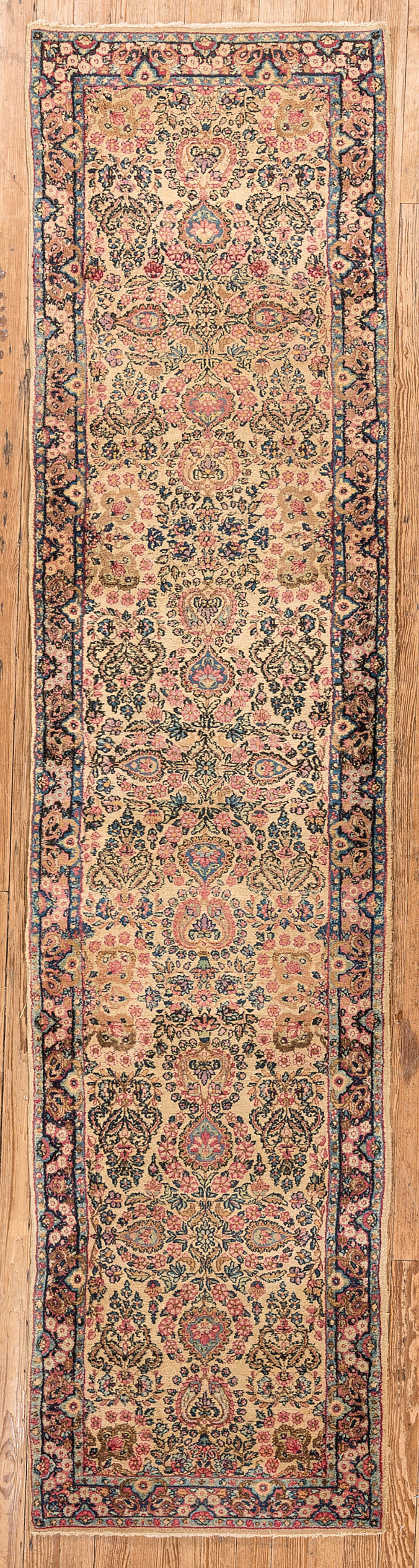 Appraisal: Kerman Runner with an allover design of flowers on a