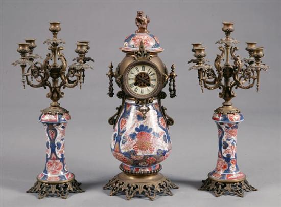 Appraisal: IMARI CLOCK AND GARNITURE SET European early th century brass