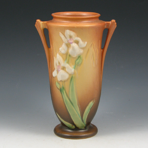 Appraisal: Roseville Iris vase in tan with double handles Uncommon form