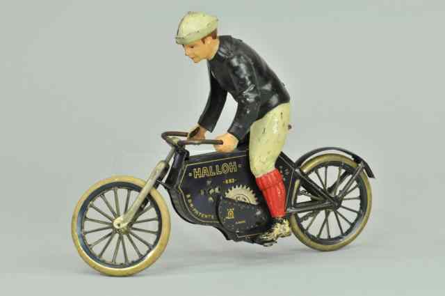 Appraisal: LEHMANN HALLOH RIDER ON CYCLE Germany lithographed tin figure riding