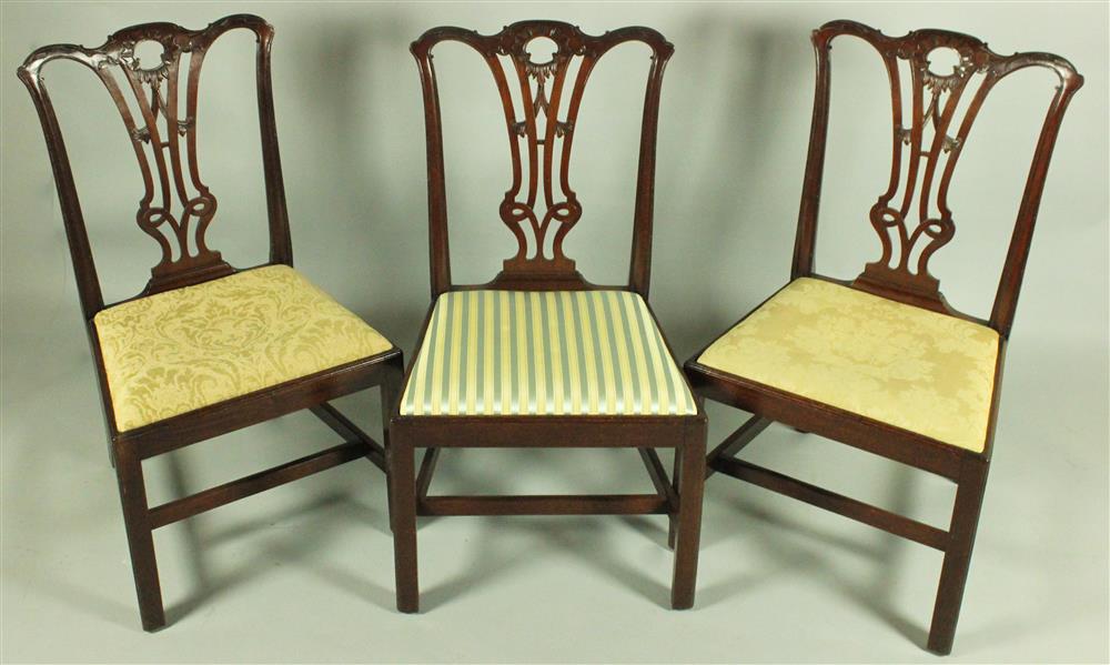 Appraisal: SET OF THREE CARVED MAHOGANY SIDE CHAIRS IN THE STYLE