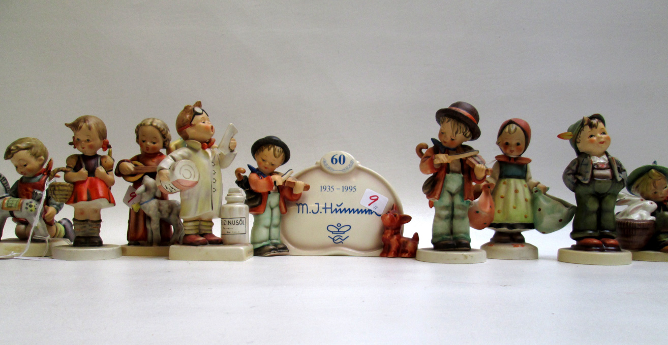 Appraisal: HUMMEL PORCELAIN FIGURINES AND PLAQUE eighteen pieces trademarks from to