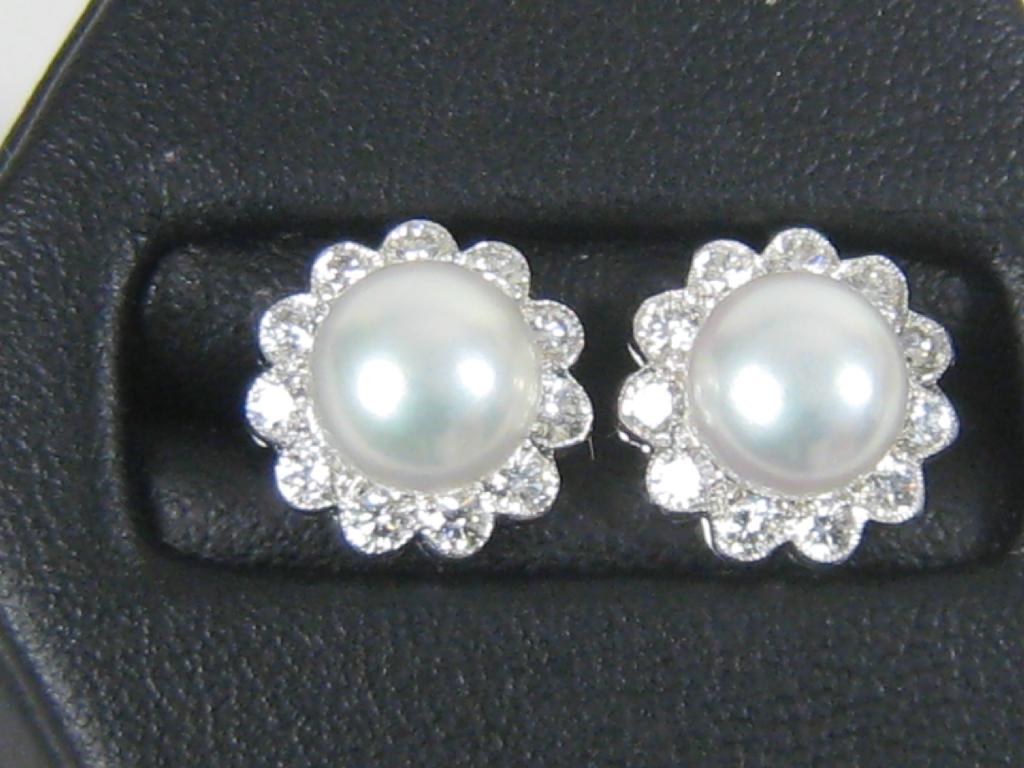 Appraisal: Pair of Pearl and Diamond Ear Studs each with central