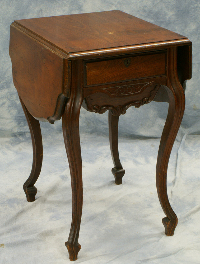 Appraisal: Carved walnut Victorian drop leaf sewing table w x h