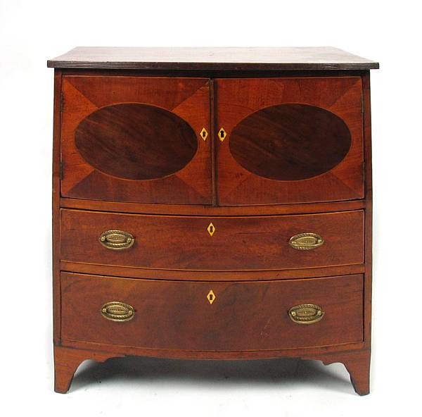 Appraisal: A Regency mahogany inlaid bow front bedside cupboard height in