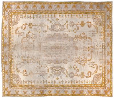 Appraisal: Oushak rug amber central design on ivory field flanked by