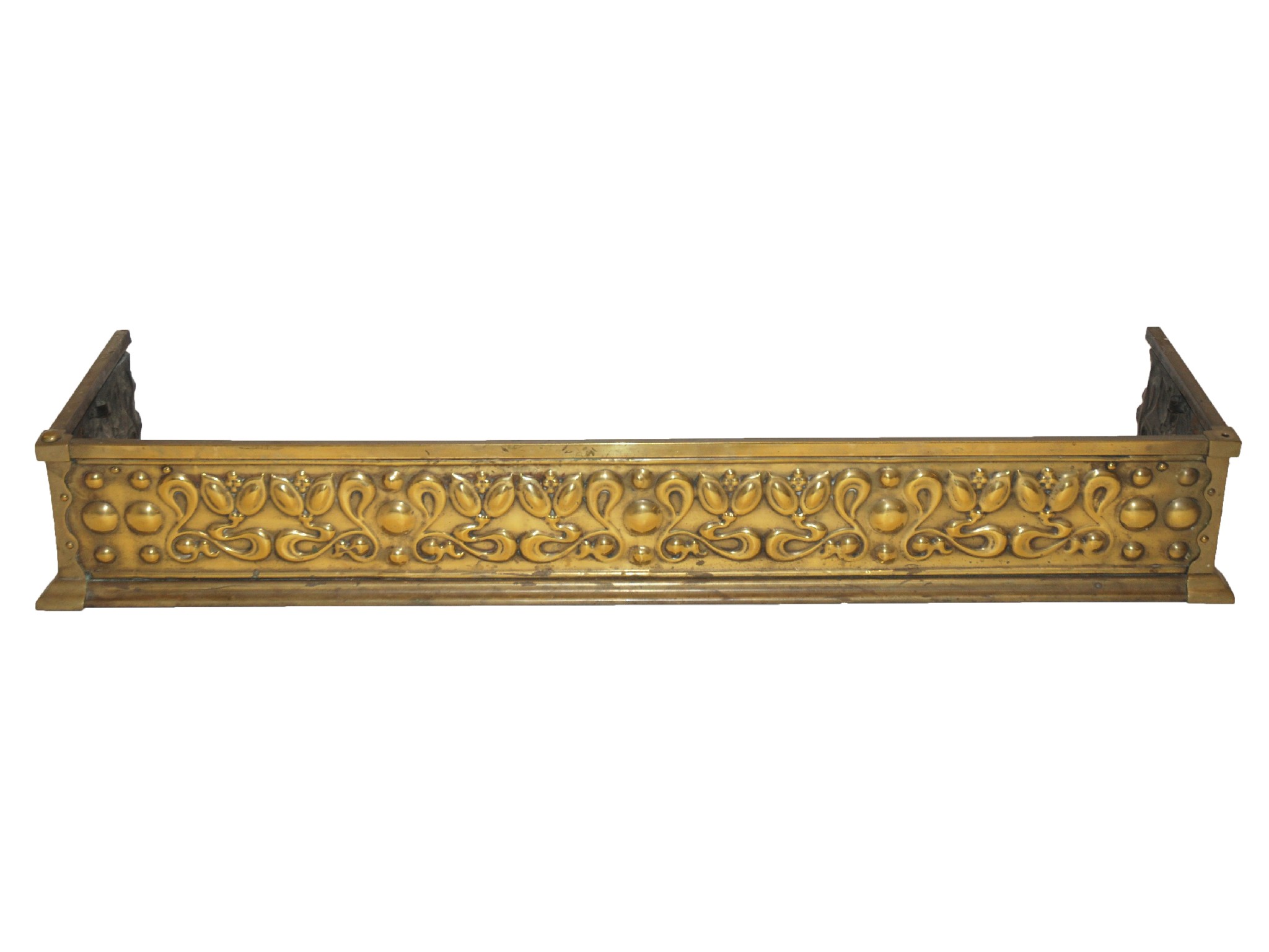 Appraisal: An Arts and Crafts brass embossed fenderwith a band of