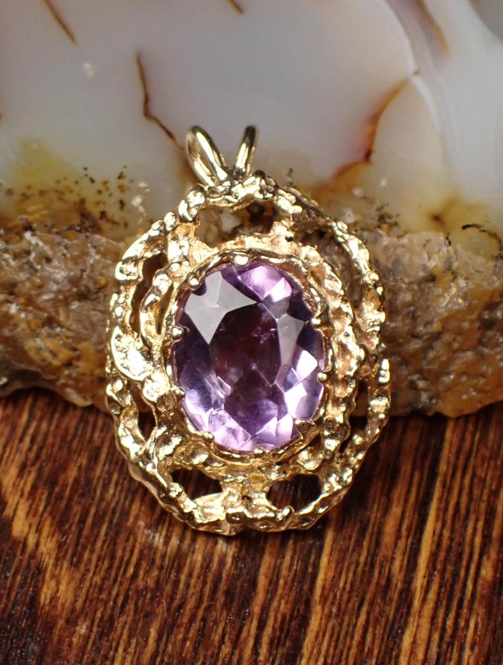 Appraisal: AMETHYST AND FOURTEEN KARAT GOLD PENDANT having a single mm