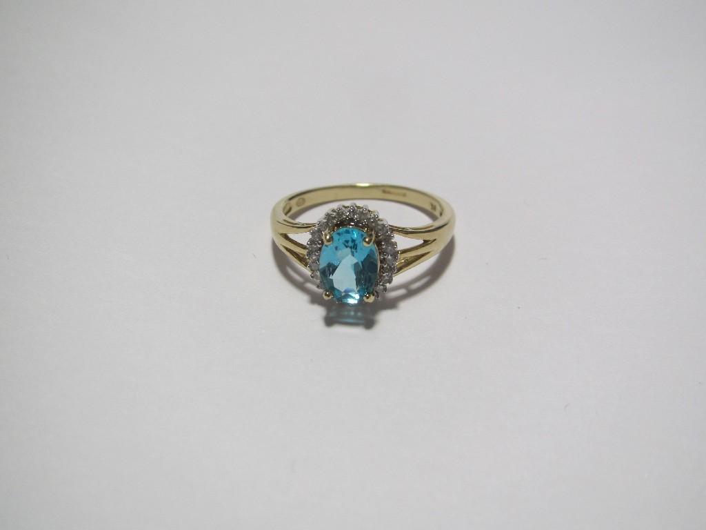 Appraisal: An oval cushion cut apatite and small diamond cluster ring