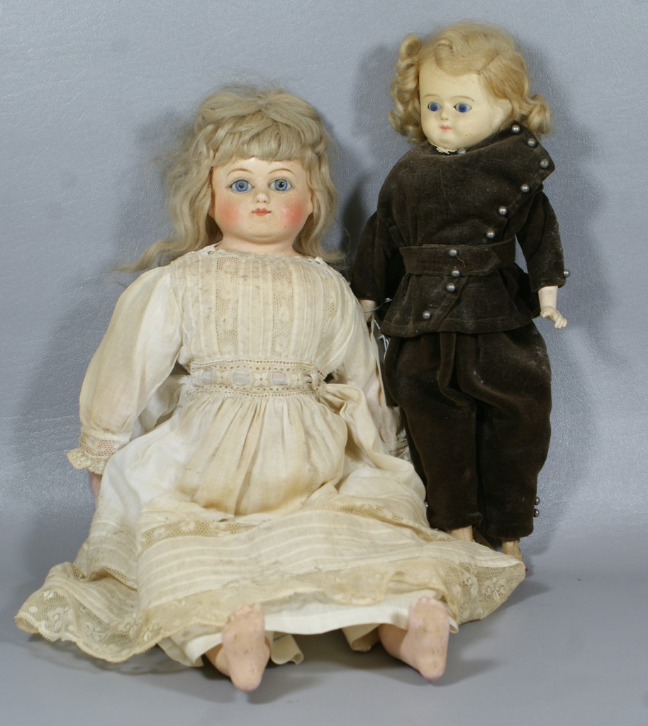 Appraisal: Wax over papier mache shoulder dolls the larger is a