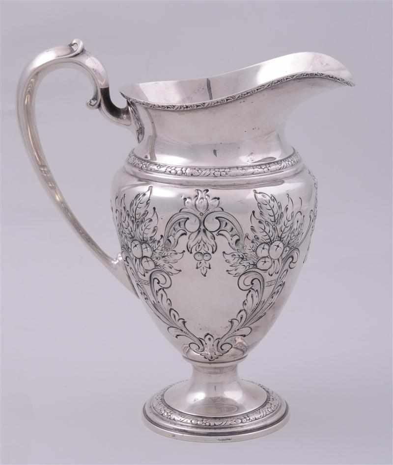 Appraisal: AMERICAN REPOUSS AND CHASED SILVER WATER PITCHER Frank M Whiting