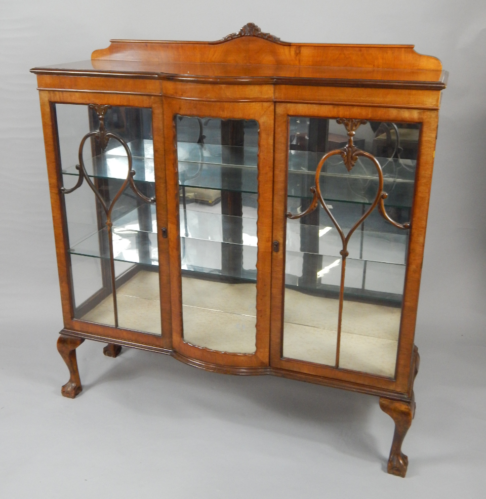 Appraisal: An early thC mahogany display cabinet the galleried top over