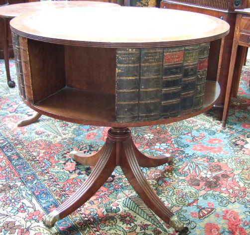 Appraisal: A mahogany drum table the gilt tooled green leather circular