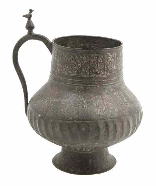 Appraisal: A Middle Eastern Metal Vessel of baluster footed form with