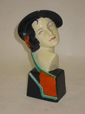 Appraisal: AN ART DECO CREAM COLOURED EARTHENWARE BUST of a young