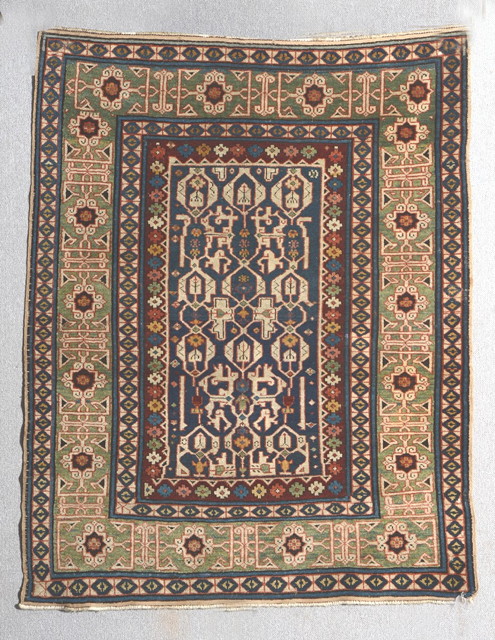 Appraisal: A SHIRVAN PASTEL GREEN GROUND RUG the central stylised guls