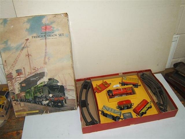 Appraisal: A METTOY RAILWAYS MECHANICAL FREIGHT TRAIN SET with clockwork locomotive