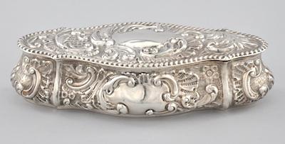 Appraisal: A British Silver Repousse Trinket Box The shape is embellished