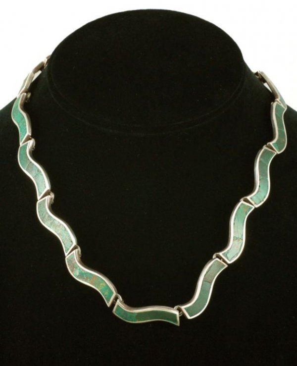 Appraisal: A sterling silver necklace consisting of irregular horizontal plaques each