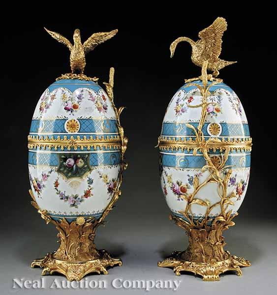 Appraisal: A Pair of Sevres-Style Gilt-Mounted Garnitures oviform each elaborately decorated