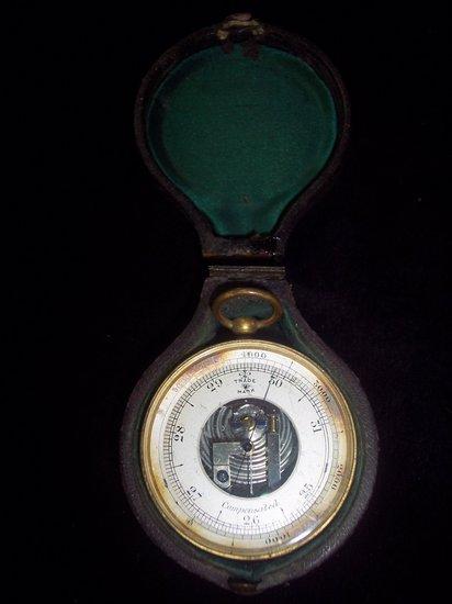 Appraisal: An aneroid barometer in a gilt metal case and the