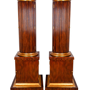 Appraisal: A Pair of Regency Style Fluted Mahogany Columnar Cabinets TH