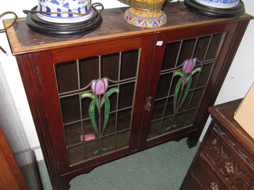 Appraisal: Mahogany cabinet with leaded glass doors