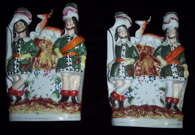 Appraisal: A pair of Staffordshire clock figures two highland hunters with