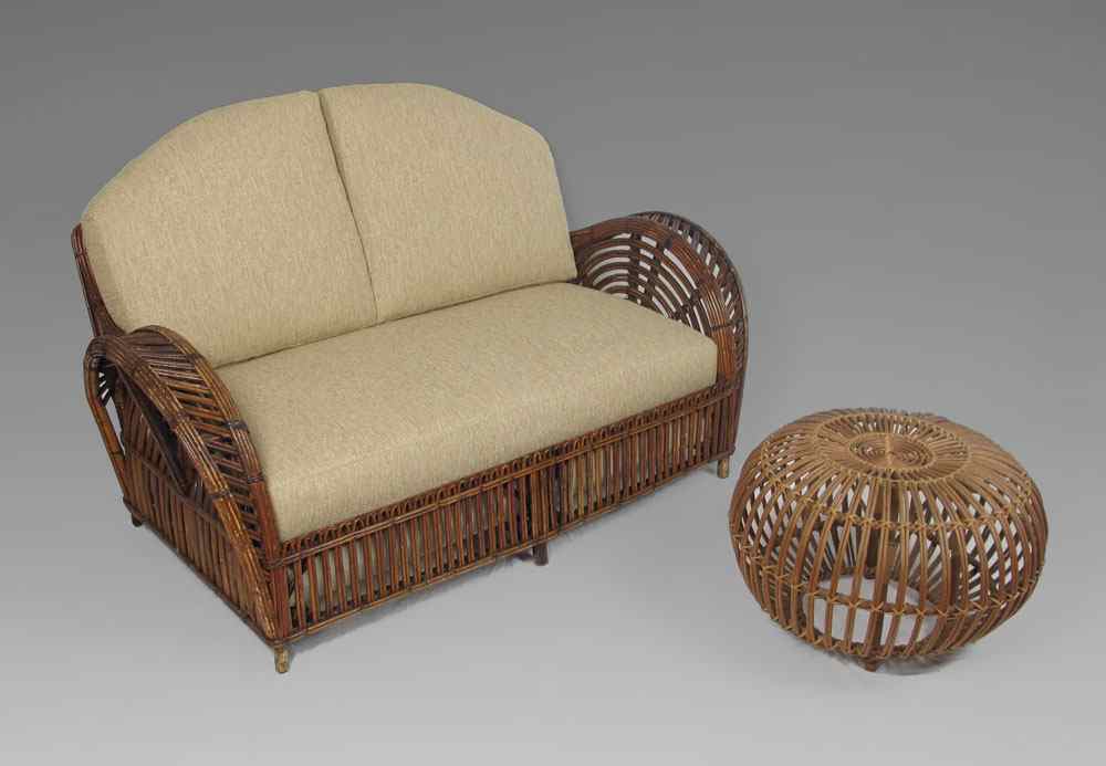 Appraisal: FRANCO ALBINI RATTAN SOFA OTTOMAN Peacock design with newly upholstered