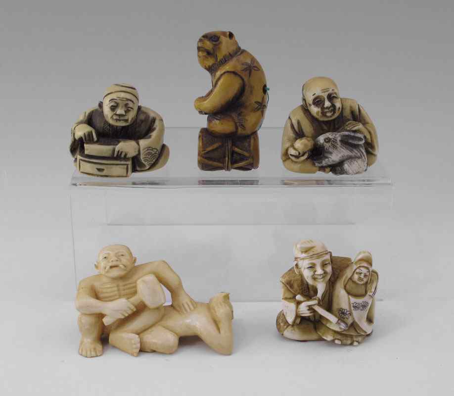 Appraisal: PIECE CARVED IVORY NETSUKE To include Artist with doll signed